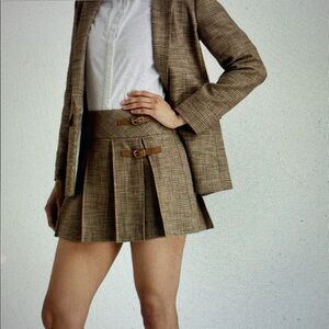 Sandro -- chic pleated houndstooth tweed mini skirt with buckle details